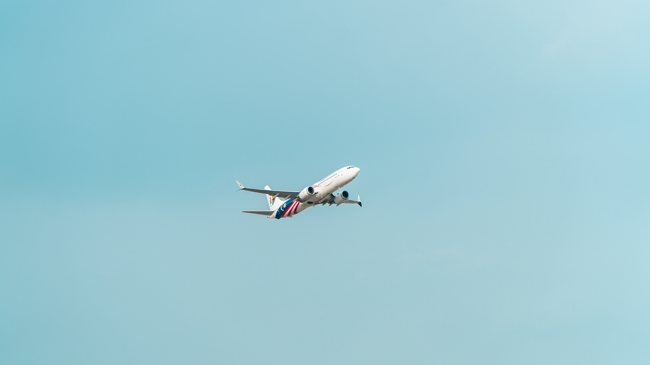 Crafting Captivating Headlines: Your awesome post title goes here Passenger airplane ascends with clear blue sky backdrop, ideal for travel themes.